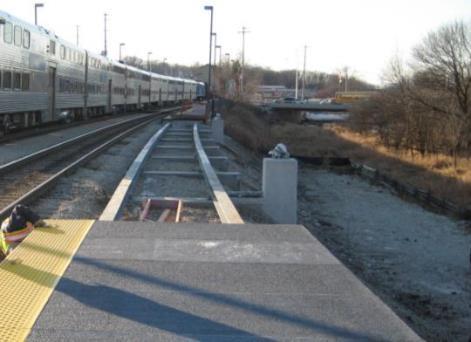 Chicago Metra Installation Platform added across from station Wetland area and slope required lightweight