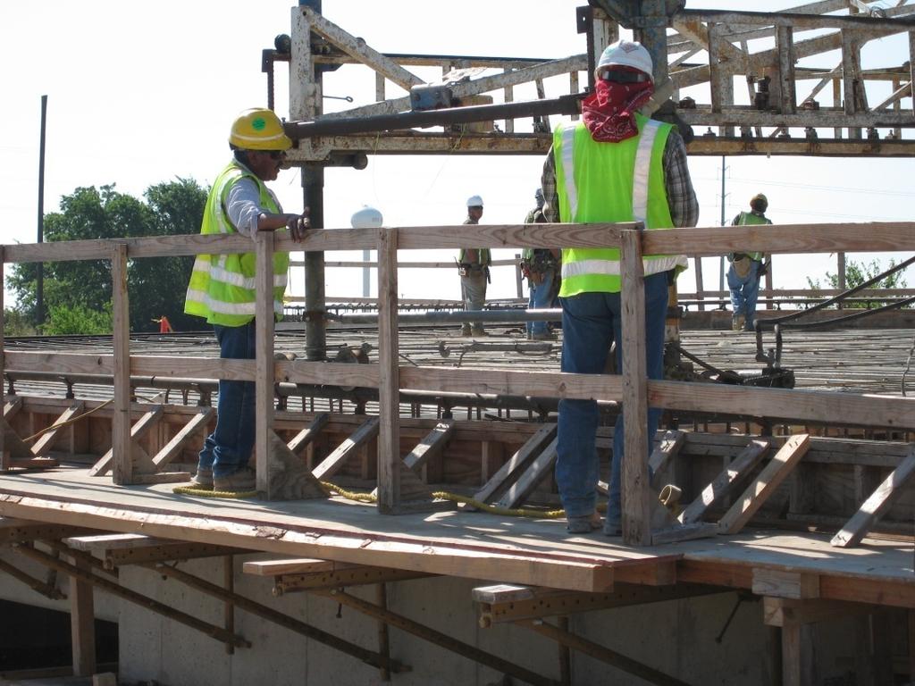 Figure 2-7: Work platform and safety rail Once the formwork is in place and assembled, sealant is applied to the joints.