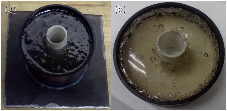 Figure 5. First prototype hybrid motor curing test (a) before and (b) after curing.