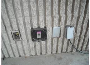 Exterior outlets are missing covers. Exterior lights appear to be in good condition, not operated.