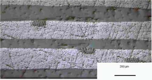 Fig. 8. Scanning electron microscopy: The picture shows the multilayer construction of a unidirectional carbon fiber epoxy laminate.