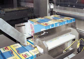 A collating device then releases product into the continuous motion flight bar, which groups and pushes the pack through the shrink film.