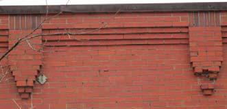 Defining Features of Walls and Windows The defining features of walls and windows may include: Decorative brick detailing on walls or around