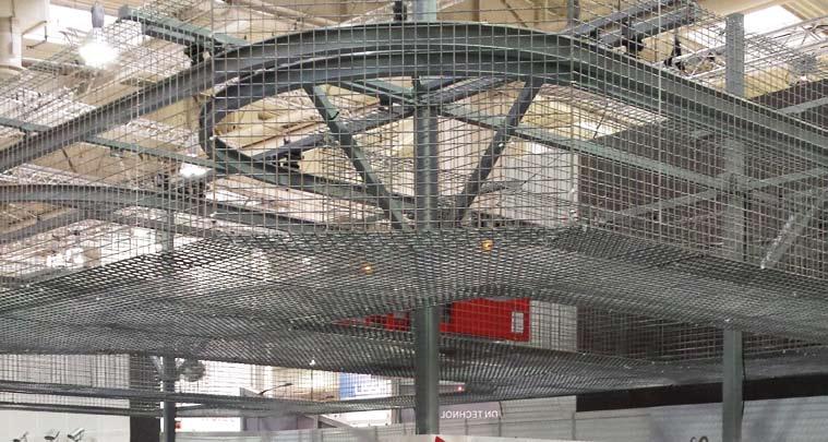 To avoid accidents caused by falling objects, protective metal mesh is placed along the circuit that allows work