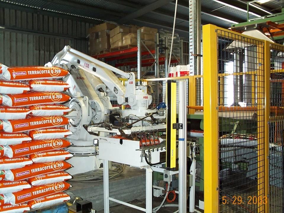 Robot stacker on fully automated bio-solids bagging