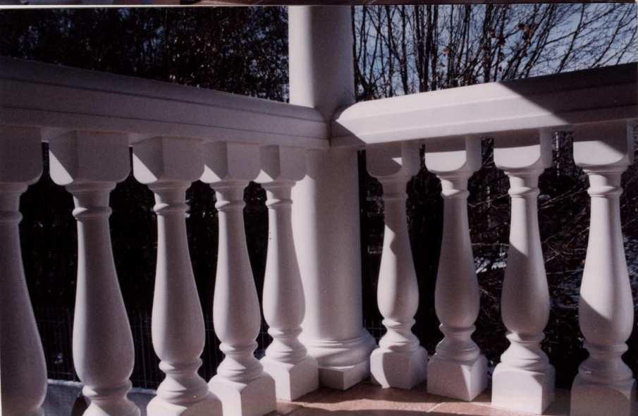 DECKS & BALCONIES Above and Below: The Cambridge commercial baluster with tall profile top railing installed to columns.