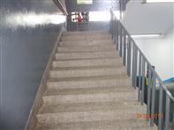 Photograph: In new packaging building and building-b an exit discharge does not meet the exterior of the building. Provide rated exit passageway i.e. protected path of egress from the exit enclosure to the public way.