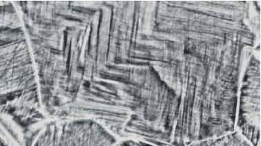 6 a 50µ m Figure 1. Steel 18Cr18Mn0.5N deformed by tension at a total strain of 0.15 at room temperature. a) OM micrograph.