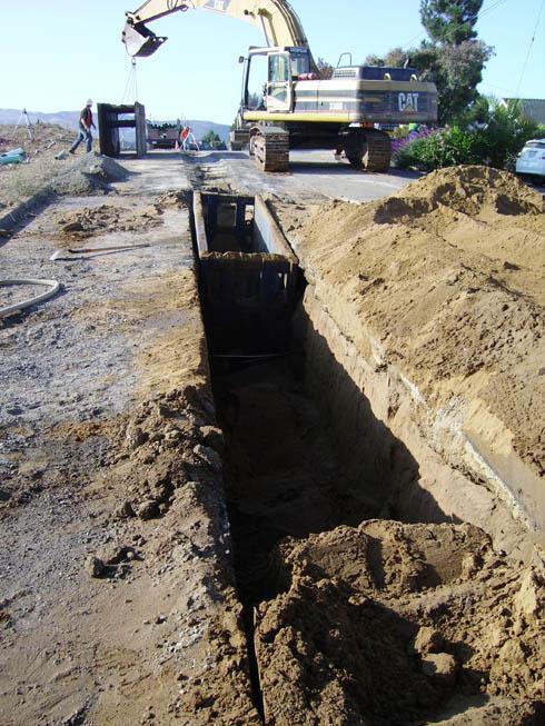 Shield systems Installation and removal of support: install and remove trench boxes in a manner
