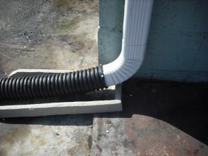 How long must a downspout extension be? Depending upon the grade, the downspout should be long enough to convey and discharge water away from structures.