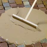 Protect gullies to prevent penetration of joint mortar. Clean the surface of the paving area to remove all bedding residues.