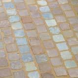 The surfaces of natural stone setts with a rough finish, reconstituted stone paving or absorbent paving blocks must be thoroughly soaked,