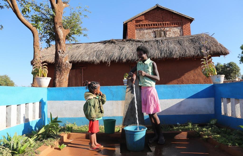 Remember Sandy (right) from the last report? Now she has clean water next to her house!