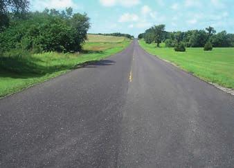 Simultaneously the 3800 CR milled (by downcutting) the existing pavement to the required thickness, added the design percentage of emulsion proportional to the working speed and added metered amounts