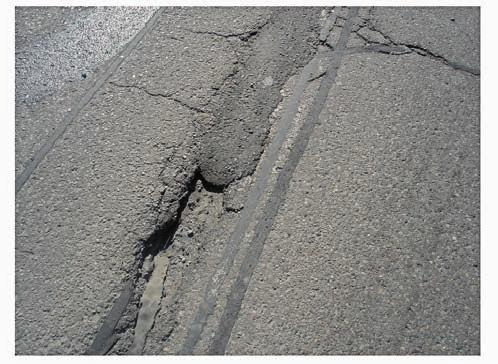 12 13 3800 CR Downcut Four-lane road, Toronto / Canada Existing pavement heavily cracked, particularly at intersections, extensive de-lamination of asphalt layers.