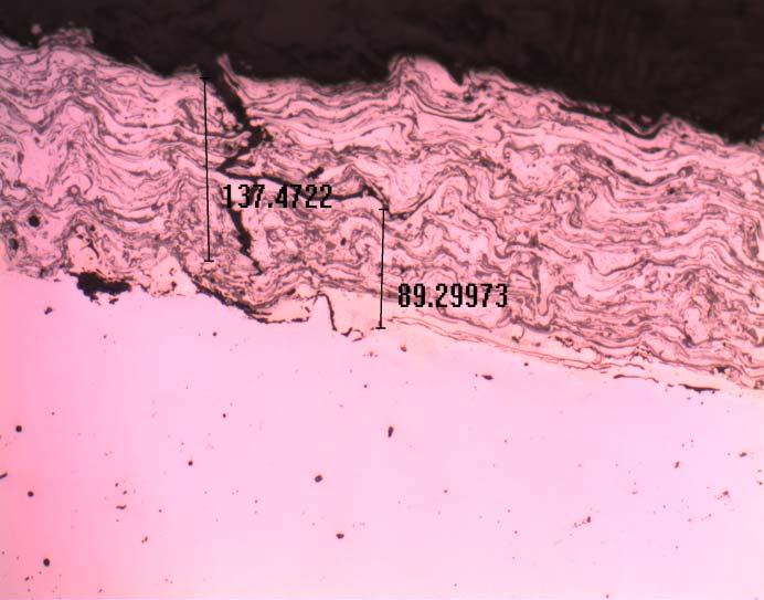 cracks initiated at the surface and at the interface between the base material and the layer are present (Fig. 12 and 13)
