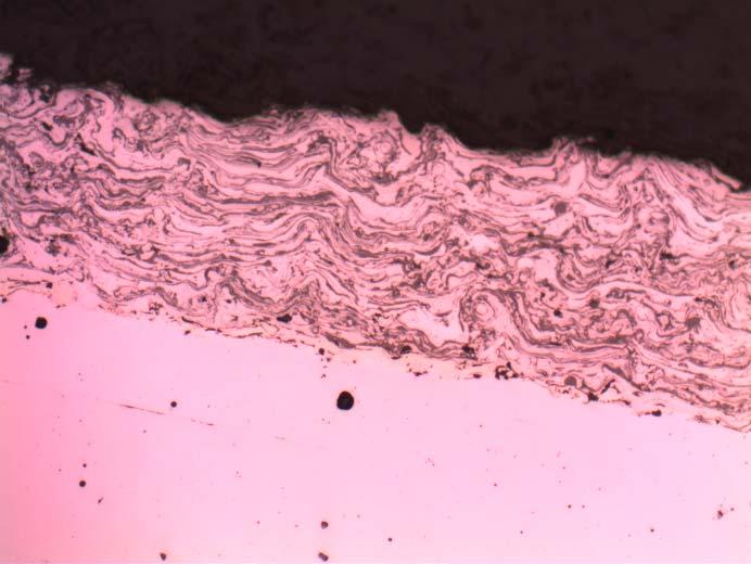 surface in the material. Fig. 15 shows a cross section in the sample with coating. Fig. 15. Cross section microscope image of the sample with coating in mixed lubrication conditions 5.