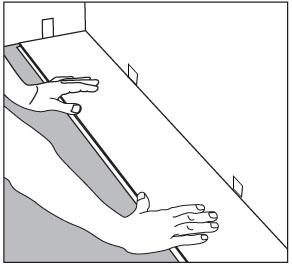 (FIGURE 4) b) Connect the sides and use a number of smaller taps on the short edge with the tapping block, until the planks lock together completely.