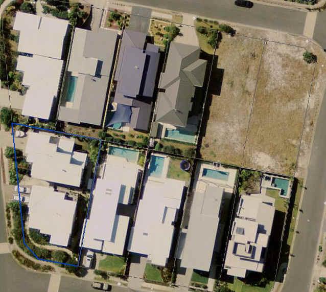 N This aerial image shows properties south facing to the street with pools in the rear yard, and properties facing north to the street with pools predominantly in the front yard.