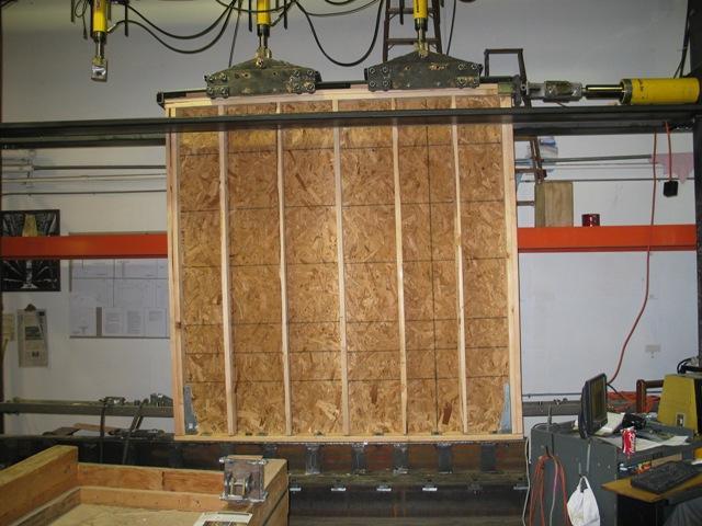 Due to an observed bending of the 3.2-mm (0.125-in.) plate washers on Wall 3a, which led to a cross-grain bending failure on the bottom wall plate, Walls 3b, 4a, and 4b were tested with 5.