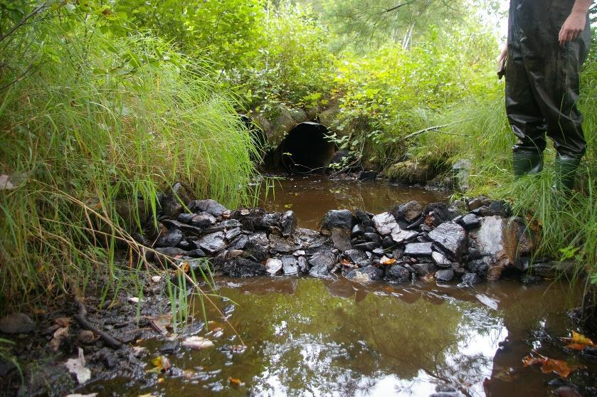 Figure 11 Two culverts restored on Cooks Brook by installing a tailwater control (left) and removing a debris blockage (right).