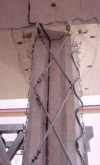 appreciable damage. Flexural cracking of the column began at a drift ratio of.25%. Shear cracks were first observed in the webs of the column at a drift ratio of 1% (ductility was 2).