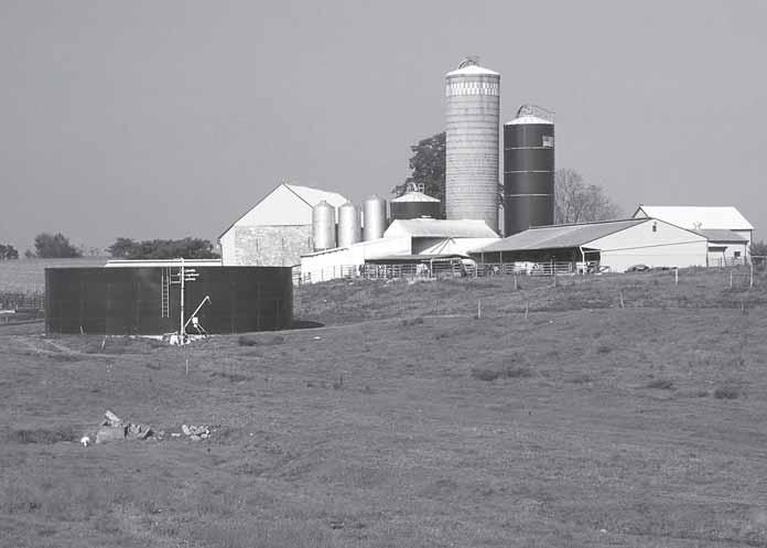 This manure storage tank is part of a conservation plan for a dairy farm. A program should be established to facilitate movement of manure from surplus to deficit areas.