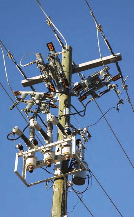 Placing the overhead lines on concrete poles instead of wooden poles may make it more aesthetically pleasing. However, the more visible lines are the large, black telephone and cable lines.