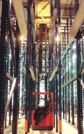 racking. Pallets are stored on guide rails in the depth of the racking and forklift trucks enter these storage lanes to deposit or retrieve loads.