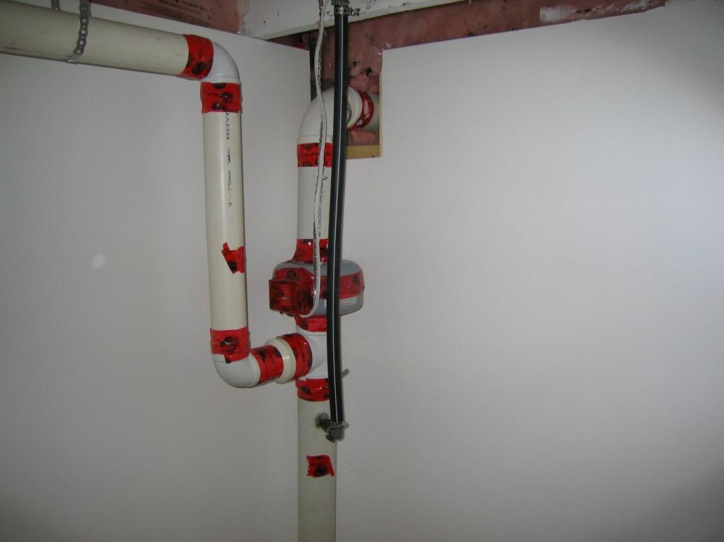 The ECHO System exhaust mechanism 12 ECHO Blower, PVC piping and sump tube. The complete perimeter stud wall and subfloor assembly is exhausted to the outside by a continuous duty blower.