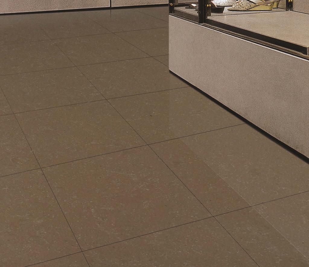 Cover photo features Avorio and Tobacco 12 x 24 field tile and Urban Metals Gunmetal 2 x 12 spiral border on the floor. Above photo features Tobacco 24 x 24 field tile on the floor.