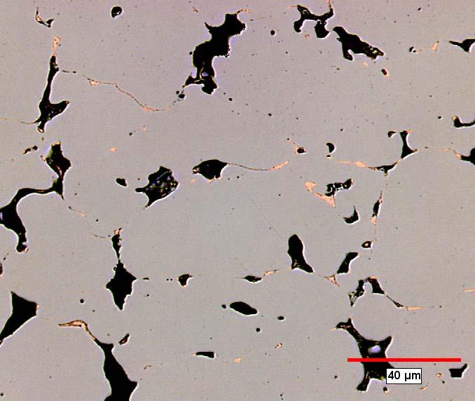 The amount of Cu in the long, thin base iron particle-particle boundaries is greatly reduced and instead, the copper is clustered around the