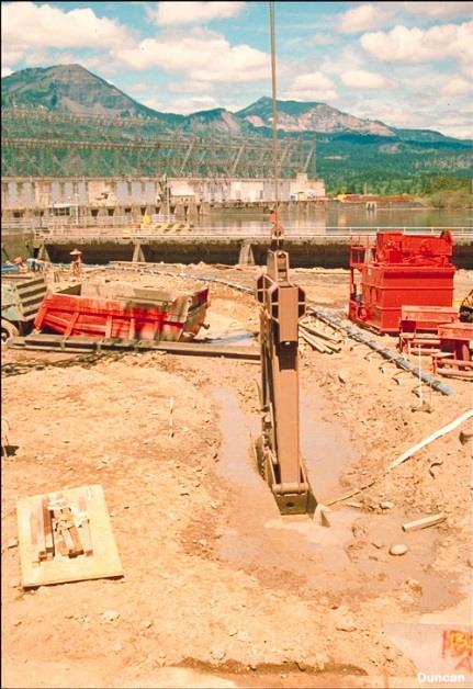 When the concrete is cured, the construction site is enclosed within a rigid, impervious barrier. This method has been employed to depths exceeding 200 feet.