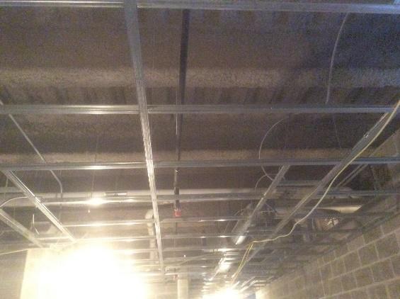 Ceiling grid installation is on-going.