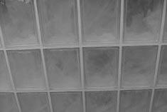 Work sponge diagonally to pick up excess grout on surface of