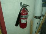 Fire extinguisher is in poor condition. 04. Electrical 04.2 Secondary Electrical 04.2-010 Secondary Switchgear Element Instance: *04.