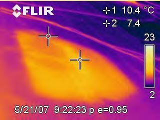 Figure 2. Thermogram and photo pair showing moisture embedded insulation on a single ply flat roof.
