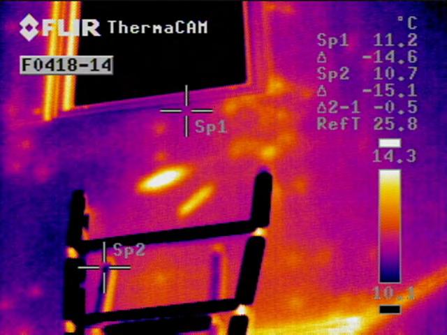 Figure 6. Thermogram and photo pair showing moisture inside the EIFS cladding.