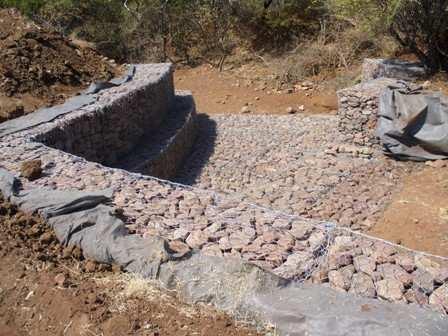 Culvert protection Gabion structures are commonly used to prevent scour at an inlet of outlet structure near a roadway, called a culvert.