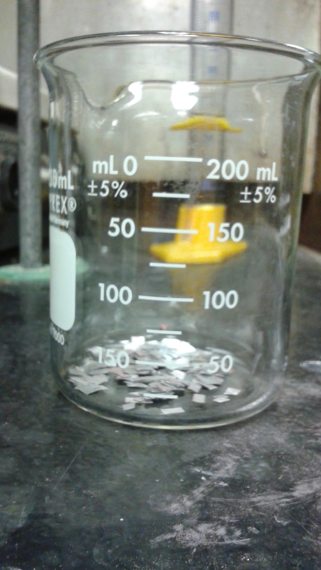 Figure 2 5. Measure 50 ml of 1.4 M KOH and pour into the 250 ml beaker containing the small aluminum squares. 6. Place the 250 ml beaker on a hot plate in a fume hood and set to low heat.