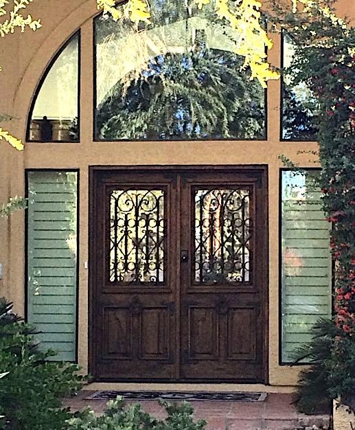 Original entry doors appear to be stained or painted,