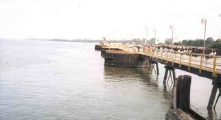 The existing trestle piers and the proposed Quick Deployment piers are not designed to handle containers due to their limited width; (3) The area