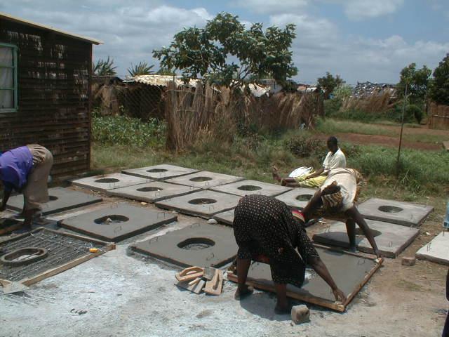 Urine-diverting toilets are built, consisting of a prefabricated wooden superstructure, asbestos roof, concrete floor slab, brick chamber and stairs, and a mortar pedestal similar to the Mexican