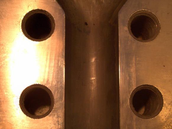 Pictures 3. These upper pictures represent the main canal of a coated and non-coated sheet extrusion die (left). These dies processed the same HIPS for 3 years.