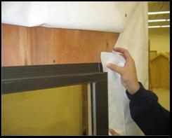 1 Apply flashing over the mounting flange of the window at both jambs. The self adhering flashing shall be a minimum of 100 mm (4 in).