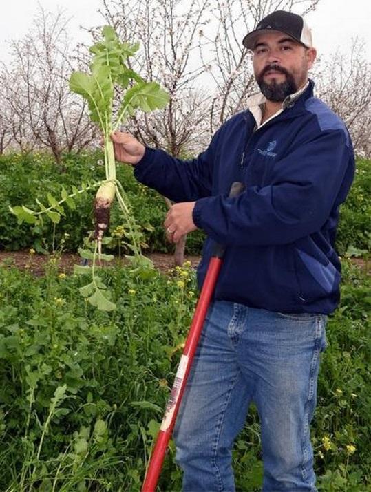 Mike Silveira of B&S Orchards holds an