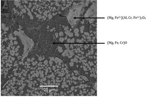 Figure 2 Backscattered electron image of the microstructure of the as-received magnesia-chrome brick magnesium oxide. The penetration that took place was minimal but uniform throughout the refractory.