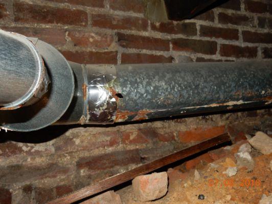 Boiler flue pipe in poor condition.