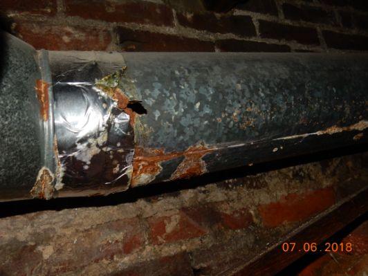 Have licensed contractor replace flue pipe.