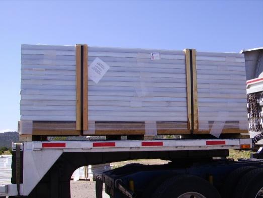 The pallets are loaded on a flat bed truck side by side (in some cases a